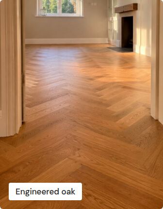 An engineered oak herringbone floor seen through a doorway
